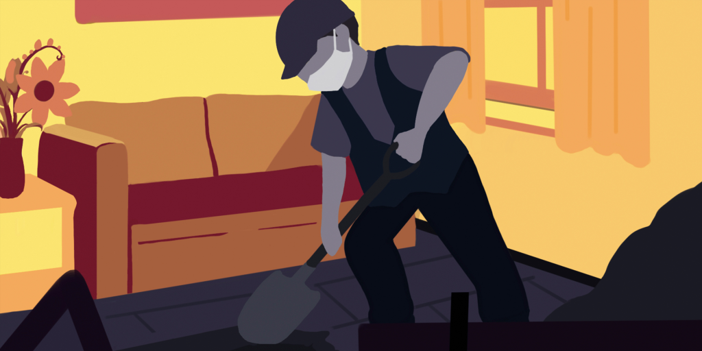 Un ouvrier creuse dans le salon